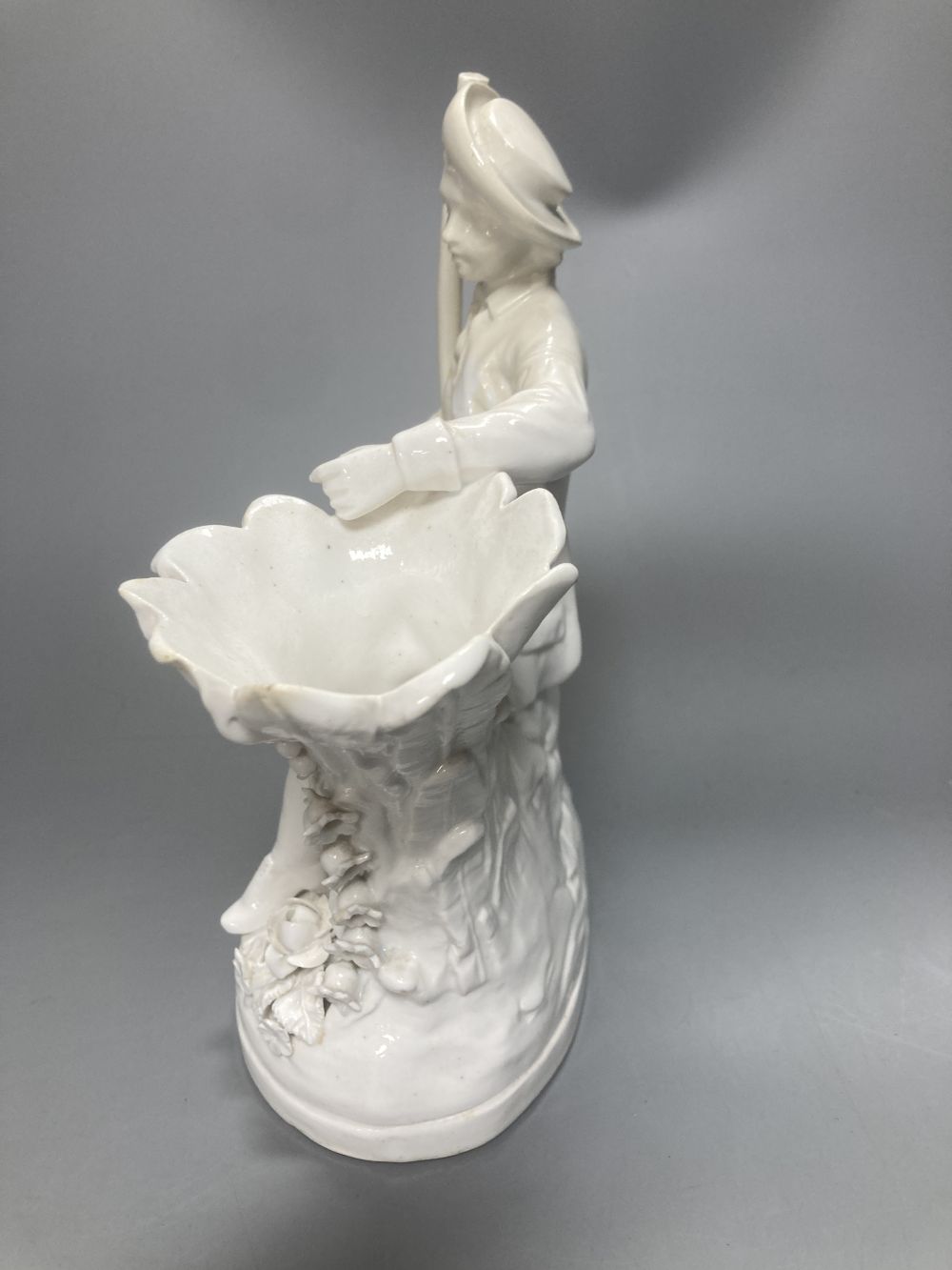A pair of John Bevington bone china figures, gardener and female companion, 21.5cm